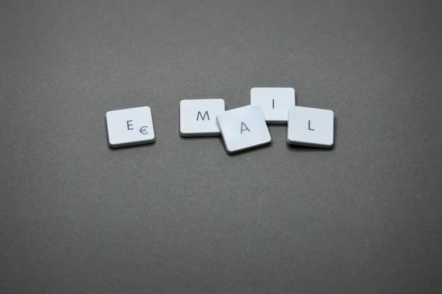 Close-up of the word 'email' formed with letter tiles on a gray surface. Email marketing strategy best practices: the discipline behind the results