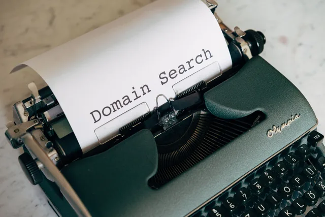 Close-up of a vintage typewriter with paper displaying 'Domain Search' text, ideal for retro themes. How to improve email deliverability without creative edits